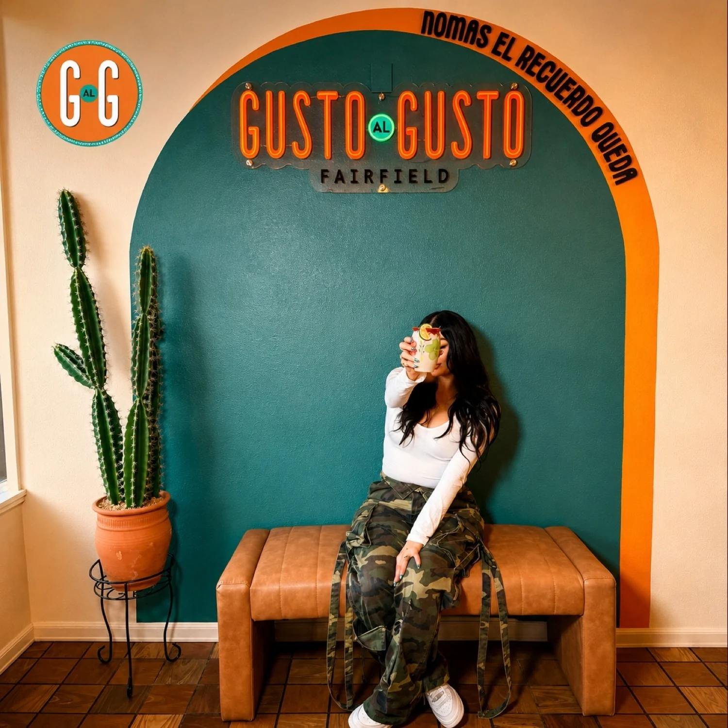 Maria Marron seated beneath the arch at Gusto al Gusto